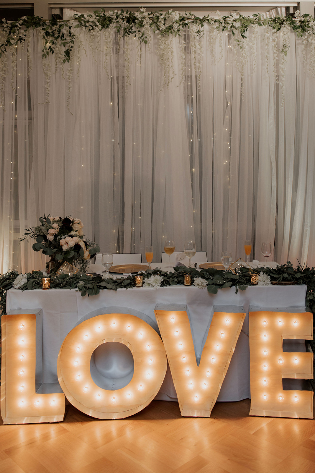 LOVE sign in front of wedding head table in Vancouver