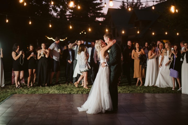 Newlyweds first dance under cafe lights on Vancouver Island