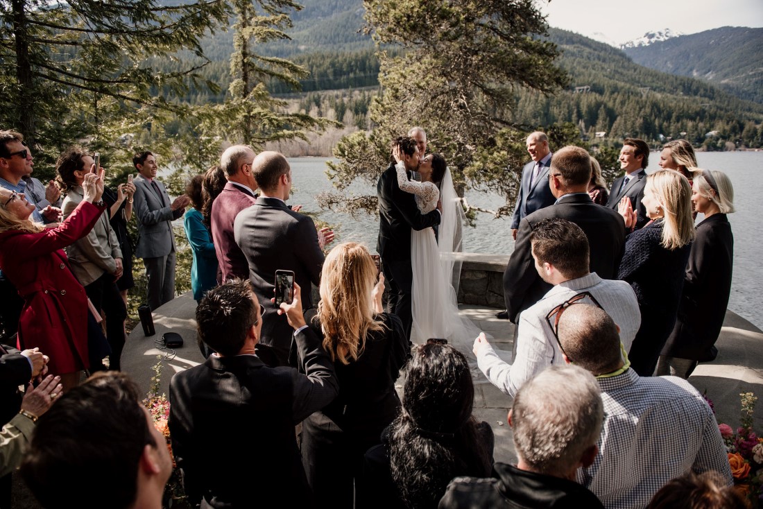 Stone Circle Whistler couple ceremony kiss with Alta Lake behind them