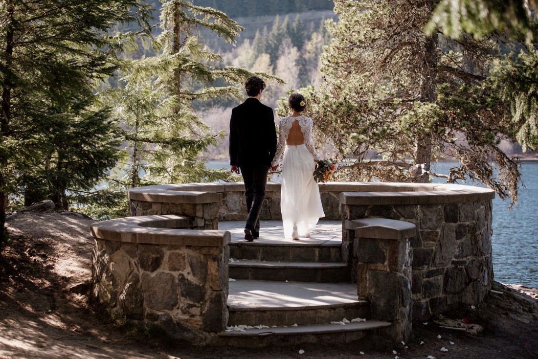 Stone Circle Whistler newlyweds look out at Alta Lake in British Columbia