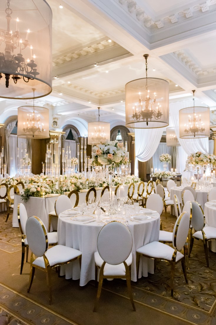 Vancouver Club Ballroom Chandeliers light up peach and white reception by Eclat Decor