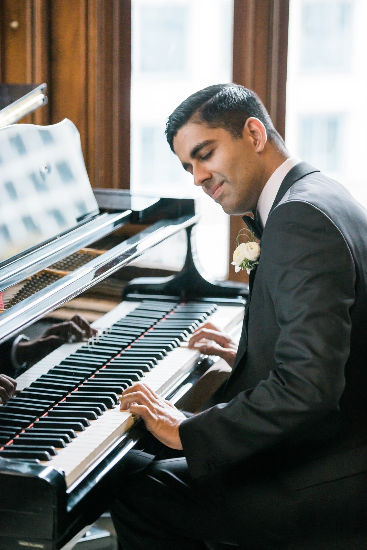 Vancouver Club Wedding Groom playing on grand piano 