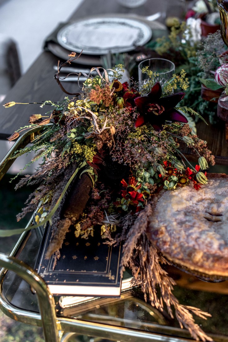 Dried grass floral centerpiece on wedding reception table by Bud and Bloom Vancouver