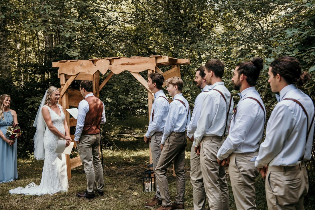 Groomsman watch wedding ceremony on Vancouver Island Farm