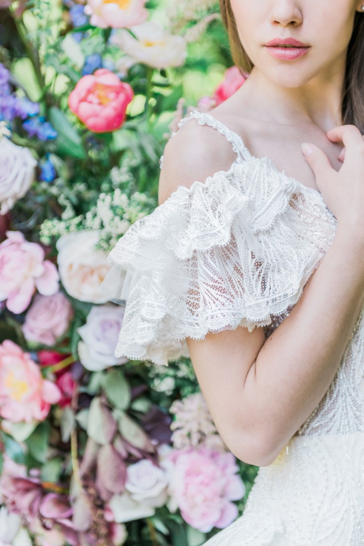 Bridal gown sleeve of lace flounces