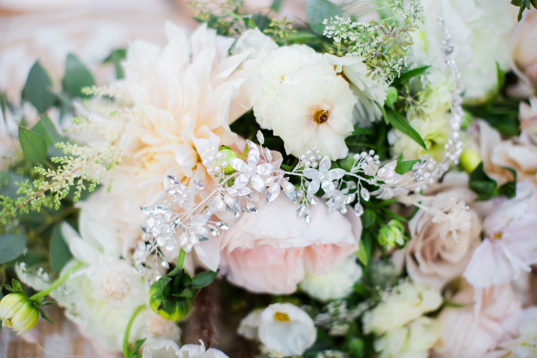 White and blush pink floral arrangement with Luxia Jewelry hairpiece Vancouver