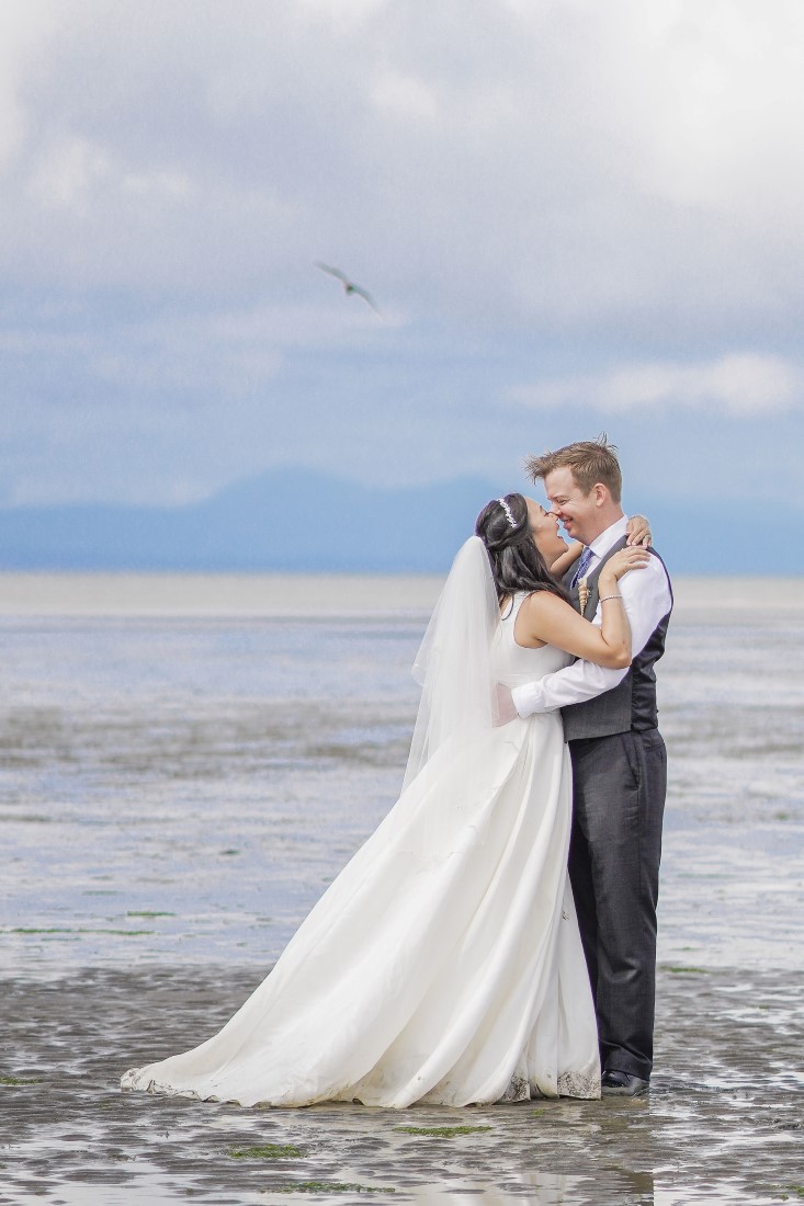 Newlyweds on Iona Beach Vancouver waterside 