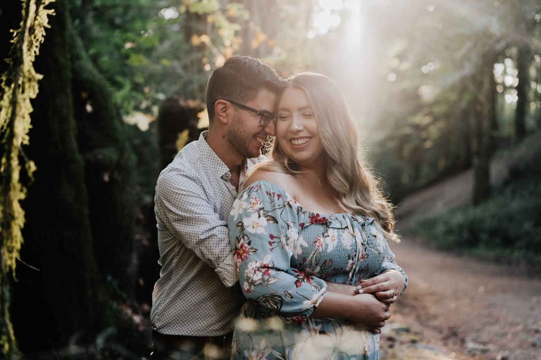 Engagement Romance Couple Hugging in Sunset by Miko Weddings