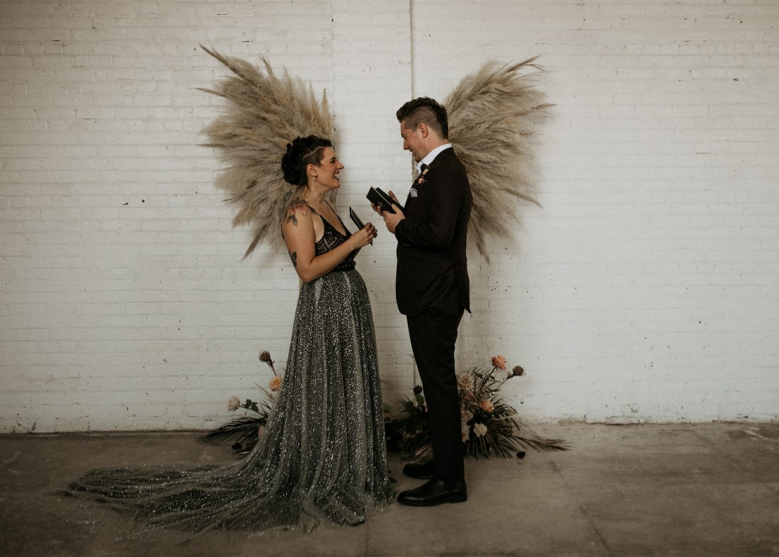 Sweet and Sexy Industrial Glam newlyweds with pampas grass wings 