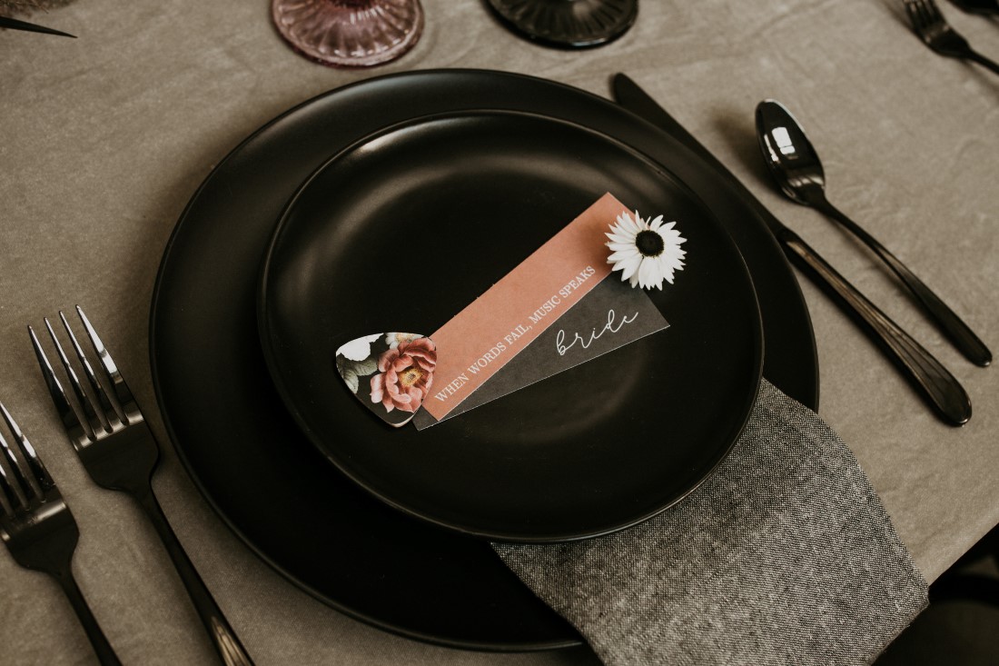 Black plate with giveaway for wedding reception