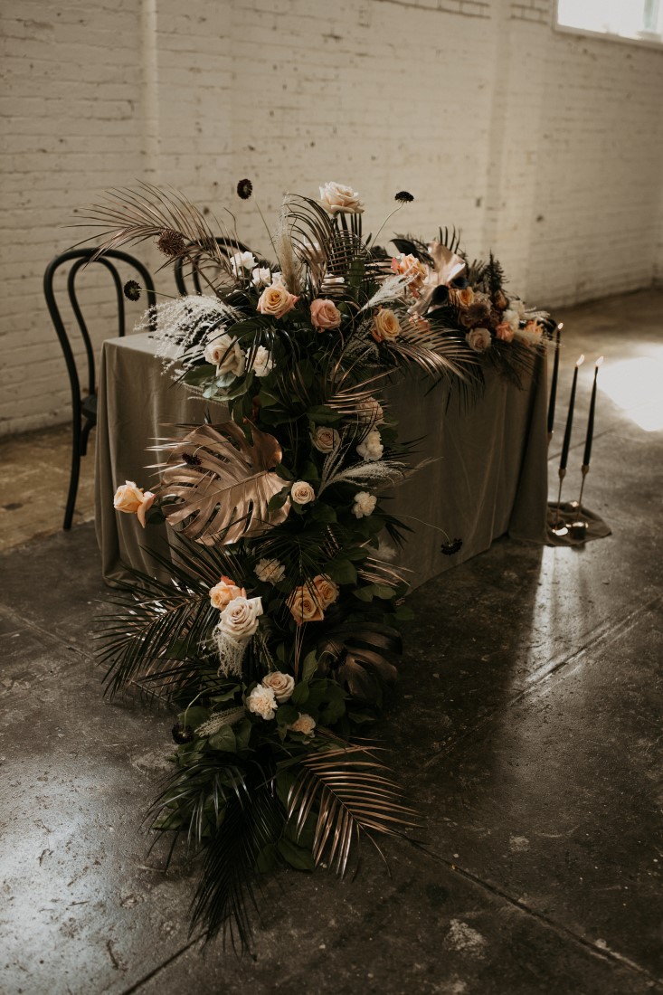 Peach White and Black Floral cascades off edge of reception head table by Bespoke Blossoms