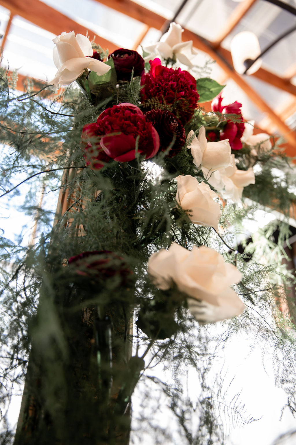 Pink orchids hanging above wedding reception table in Vancouver