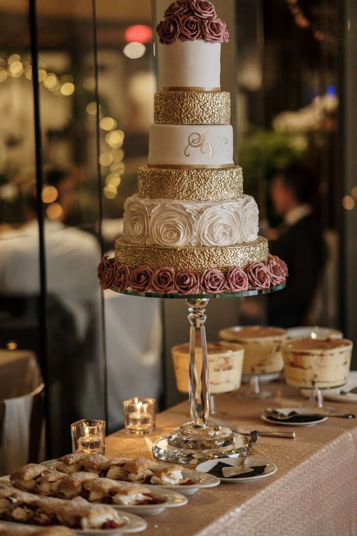 Five tiered gold and white wedding cake by Ooh La La Cupcakes