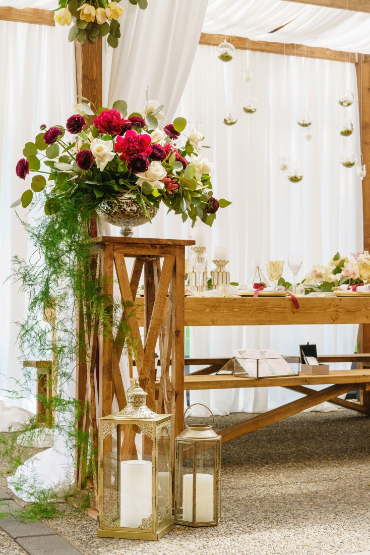 Pink and white orchid floral arrangement on top of wood lifter at Pacific Gateway Vancouver