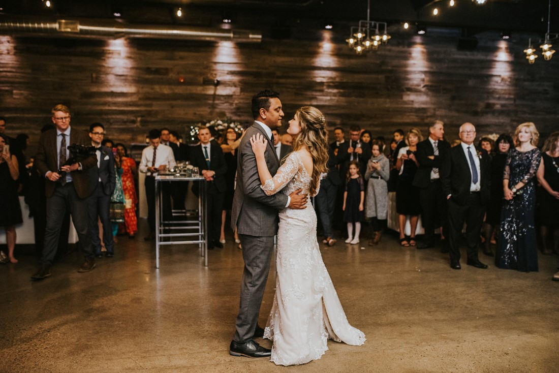 Newlyweds first dance in front of guests