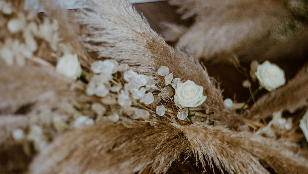 Pampas grass and white roses bridal bouquet by Van Simone Flowers