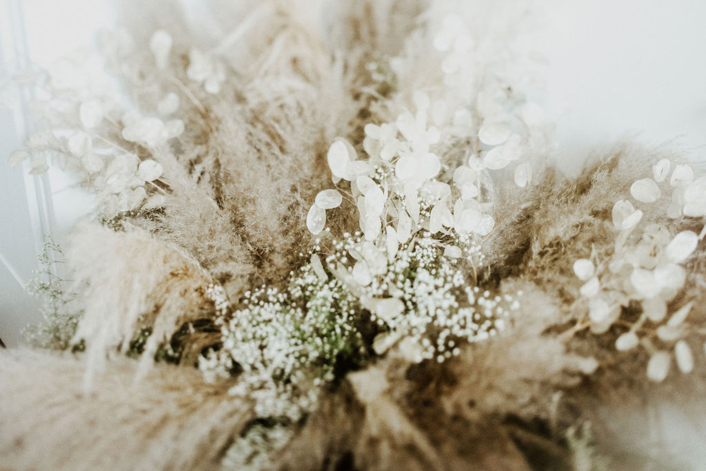 Pampas grass and white flowers in bride's bouquet by Van Simone Florals Vancouver