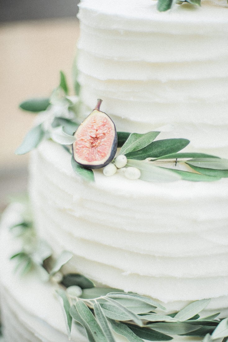 White cake with greenery by Taylor Made Cakes