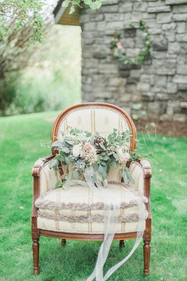 Bridal Bouquet sits on white french country chair by Dream Day Bouquet