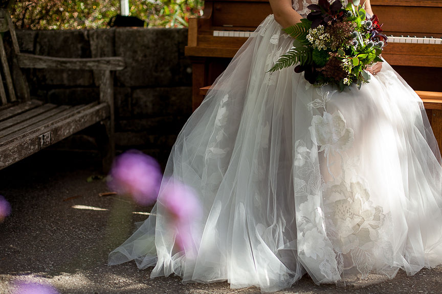 Skirt of Willowby by Watters gown and bridal bouquet