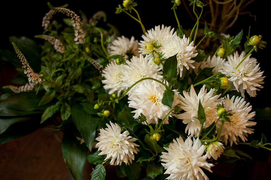 White dahlias and greenery on wedding table by Flower Factory Vancouver