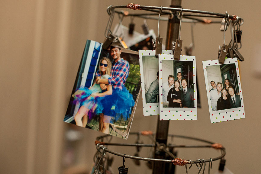 Childhood photos on wheel at wedding guest table in Vancouver