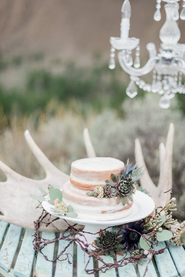 Wedding Cake sits beside skulls