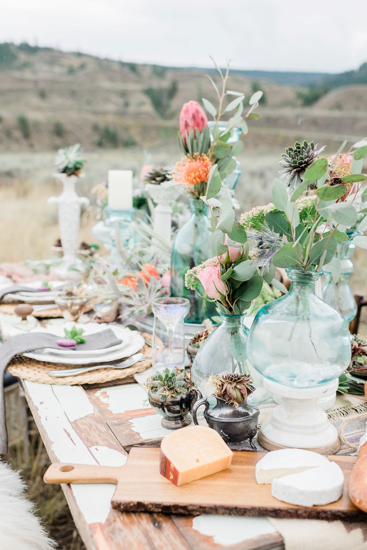 Boho Inspired Tablescape with coloured glass and colourful flowers