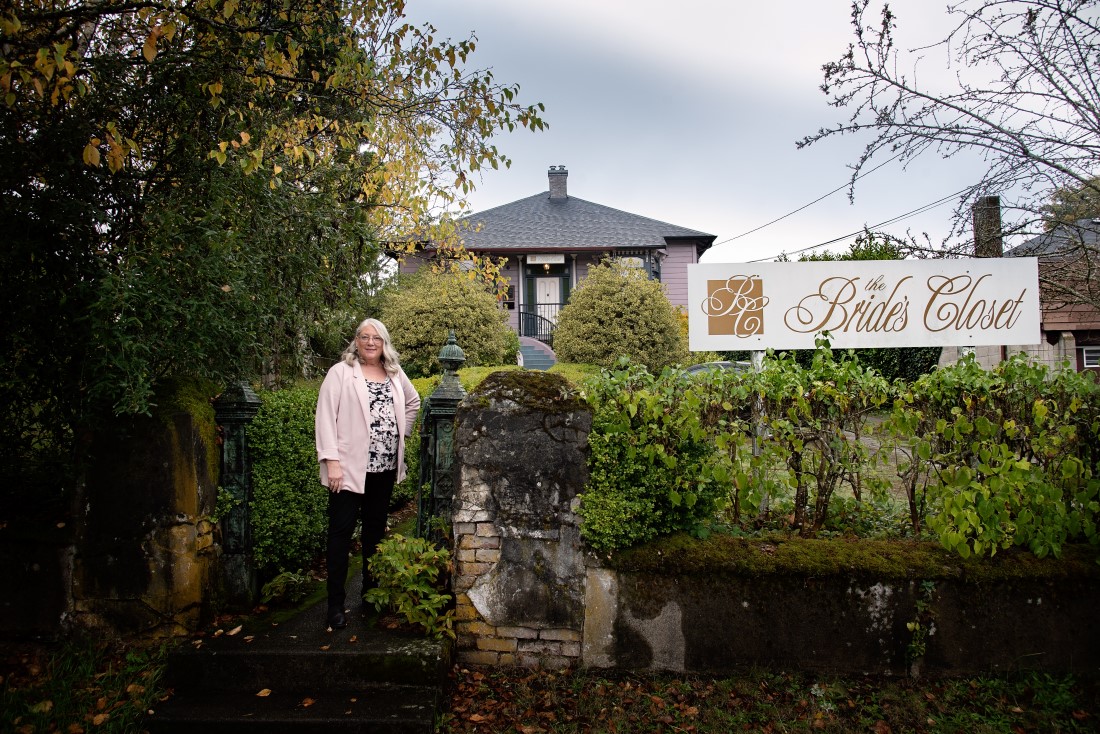 Fern, the owner of The Bride's Closet in Nanaimo, stands in front of the bridal gown house