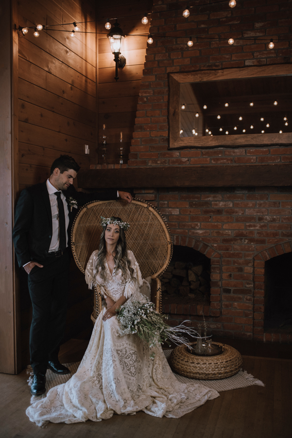 Bride and Groom sit in wicker chair at Dolphin's Resort Campbell River