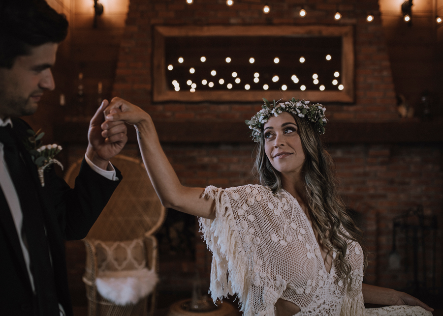 Groom leads bride by the hand at Dolphin's Resort Campbell River