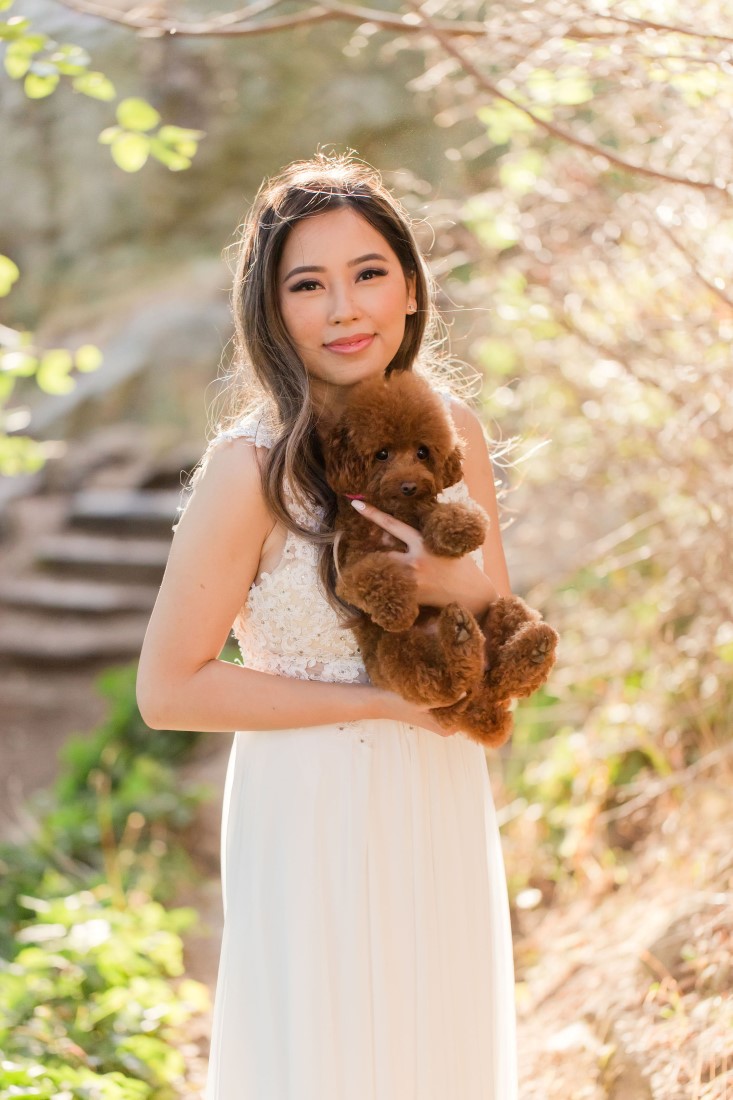 Puppy held by engaged bride to be in Vancouver