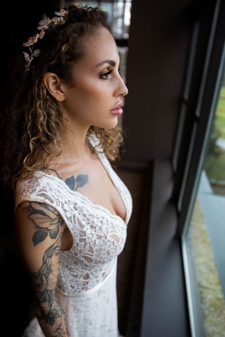 Bride with tattoos in bridal gown by Isabelle's Bridal Vancouver