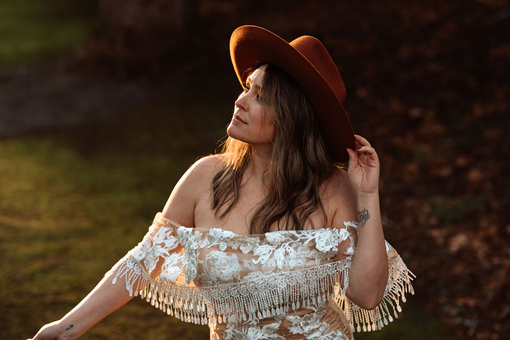 Bride in She Wore Flowers gown with Shop West Von brown felt hat