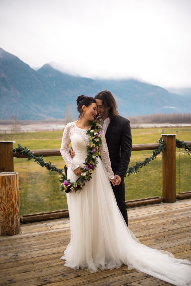 Cozy Elopement Inspiration couple in front of mountains 