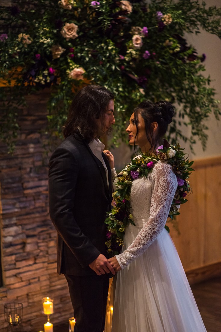 Bride and groom with floral necklace 