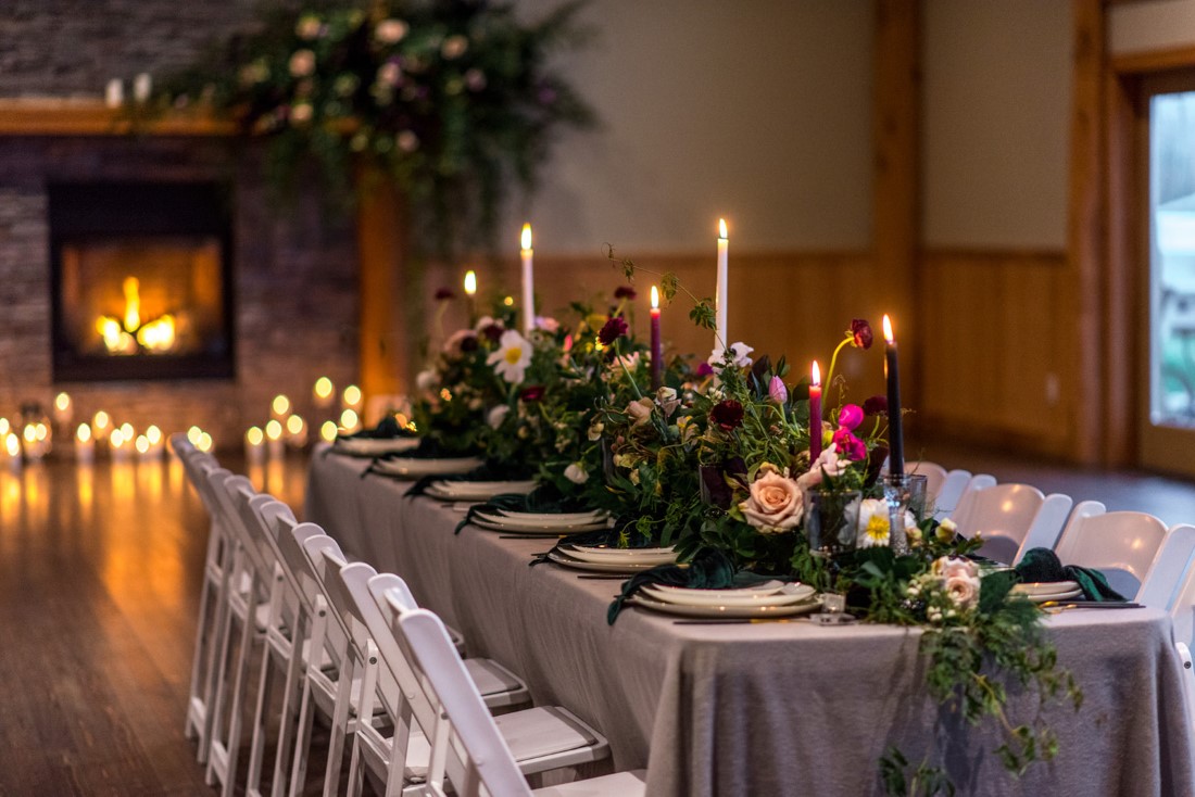 Wedding reception table with candlesticks and flowers by All Her Flowers and Winston Table Curations 