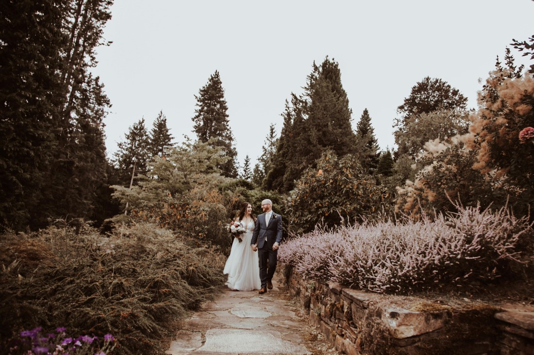 Newlyweds walk along garden paths of Blaylock Mansion