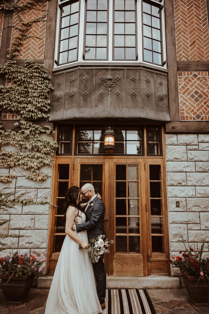 Newlyweds on the front steps of Blaylock Mansion