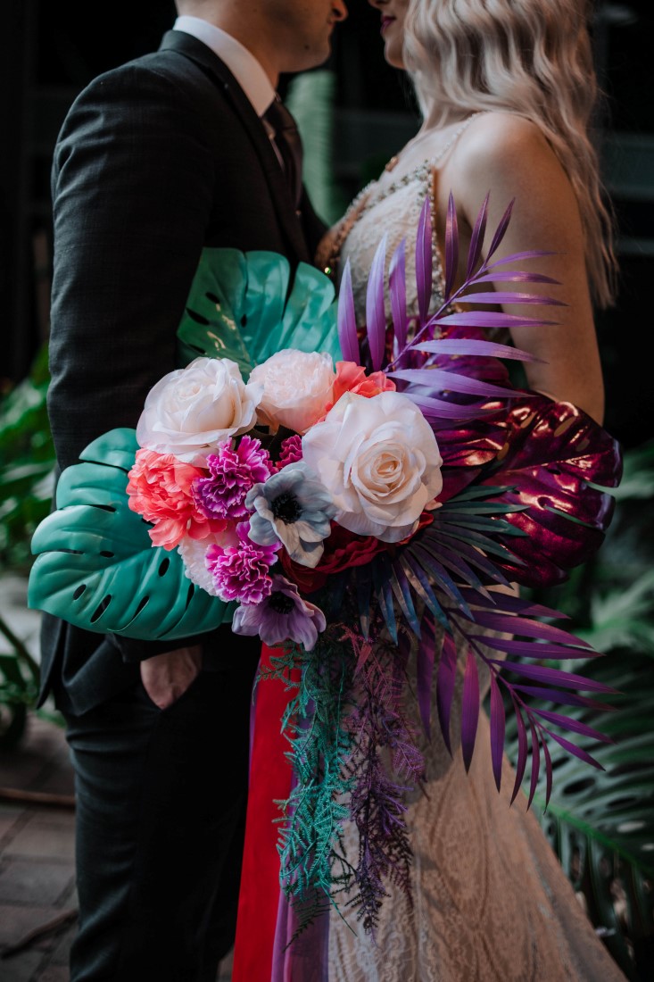 White peonies and anemone with palm leaves bouquet by En Vied Events