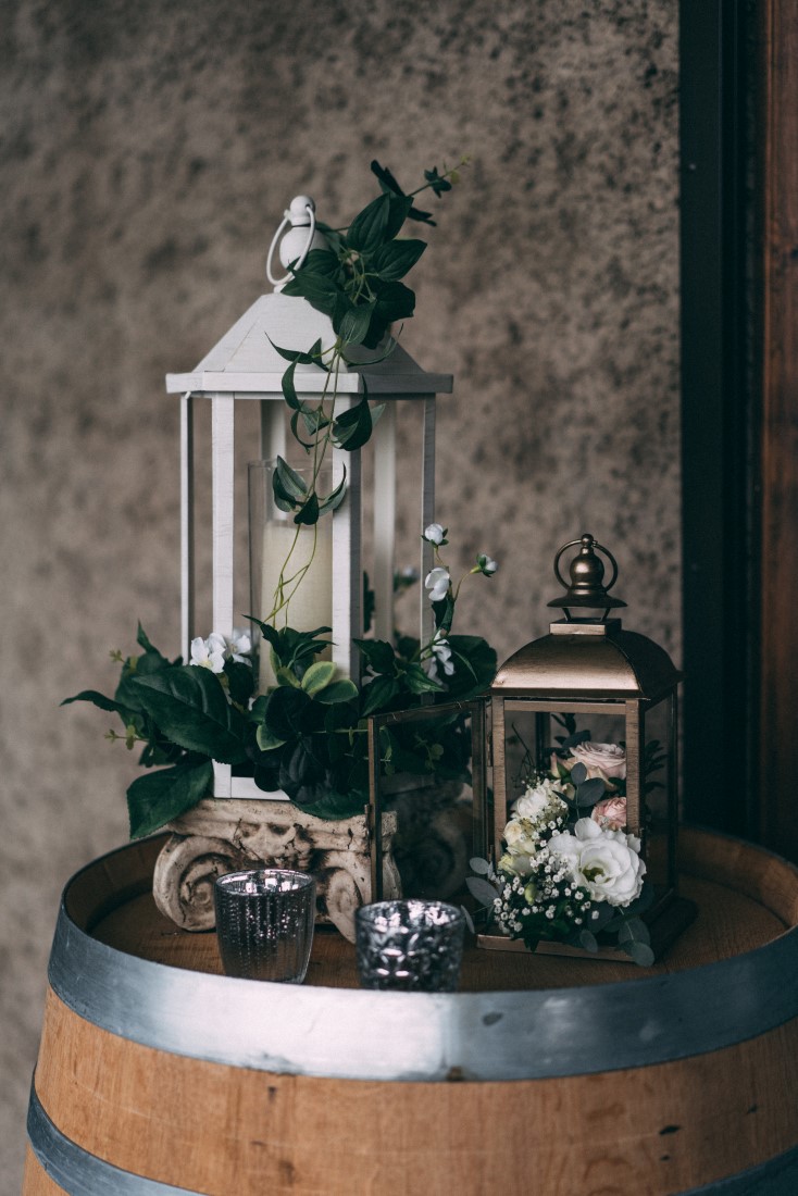 Silver lanterns with greenery by The Little Wedding Shoppe Vancouver