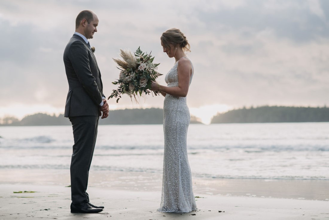 Bride gives vows to groom while eloping on Tofino beach