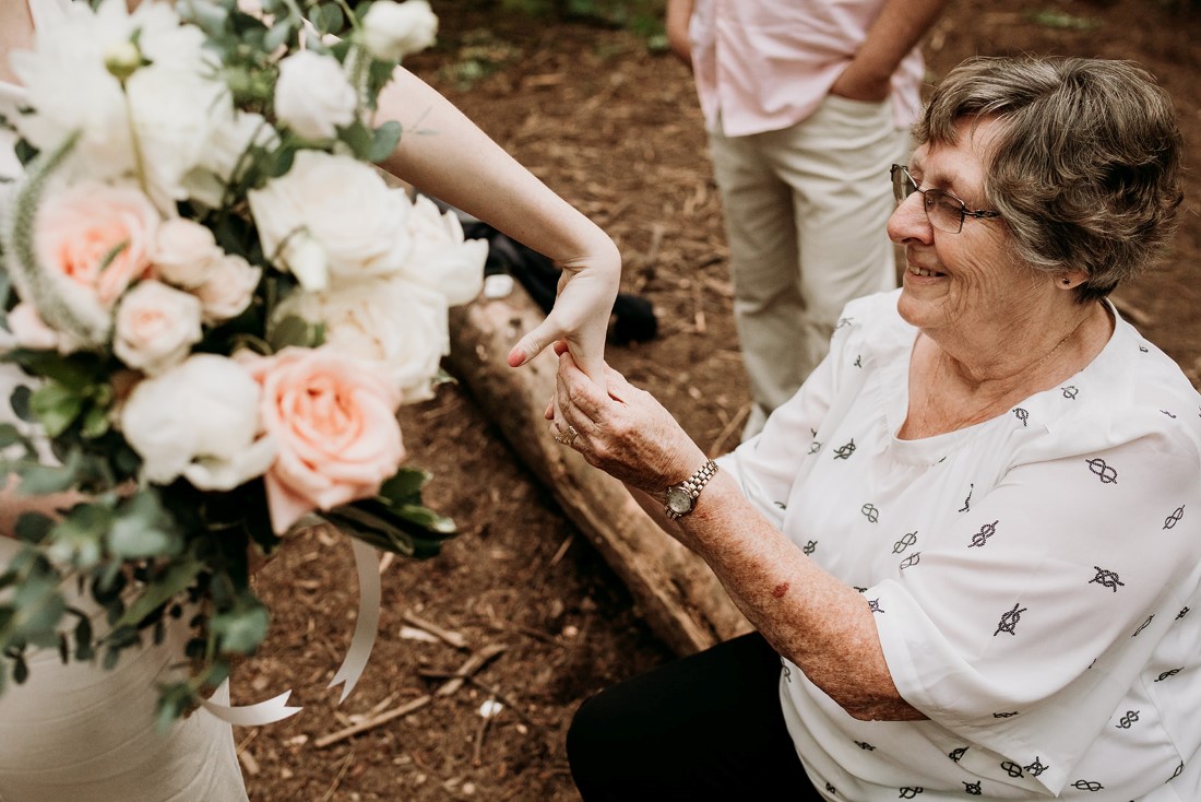 Bride receives gift from mother