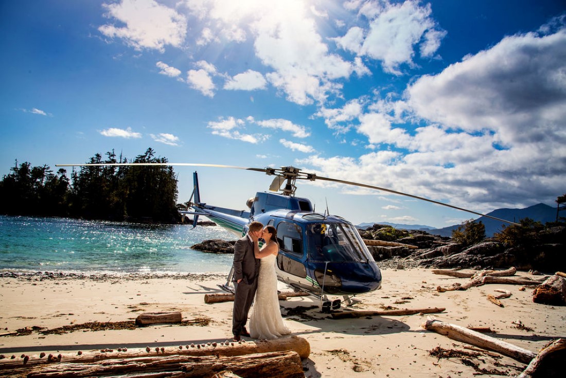 Wedding From Above Janayh Wright Photography couple kissing in front of helicopter