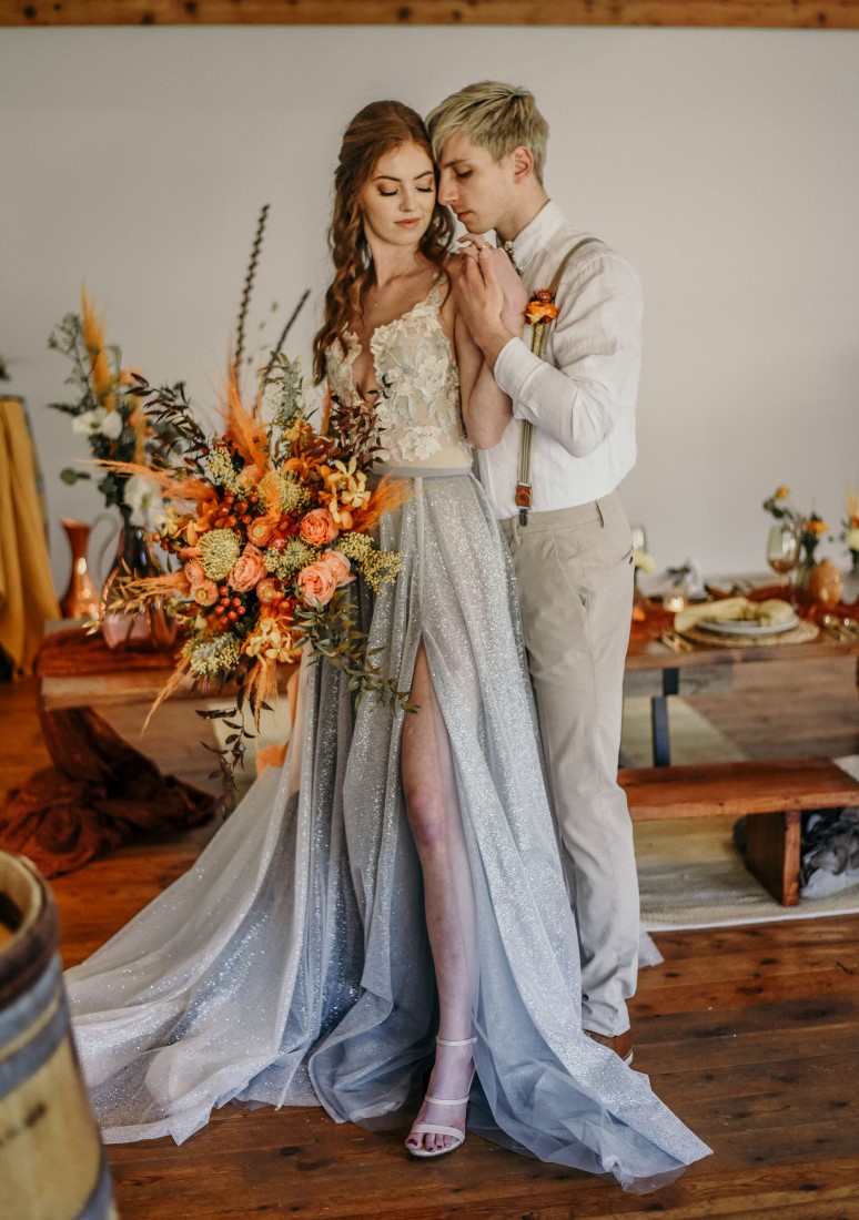 Deep Cove Winery Wedding Dayla Weiss Photo bride shows off slit skirt