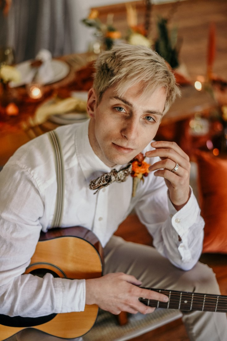 Deep Cove Winery Wedding Dayla Weiss Photo Groom holding guitar