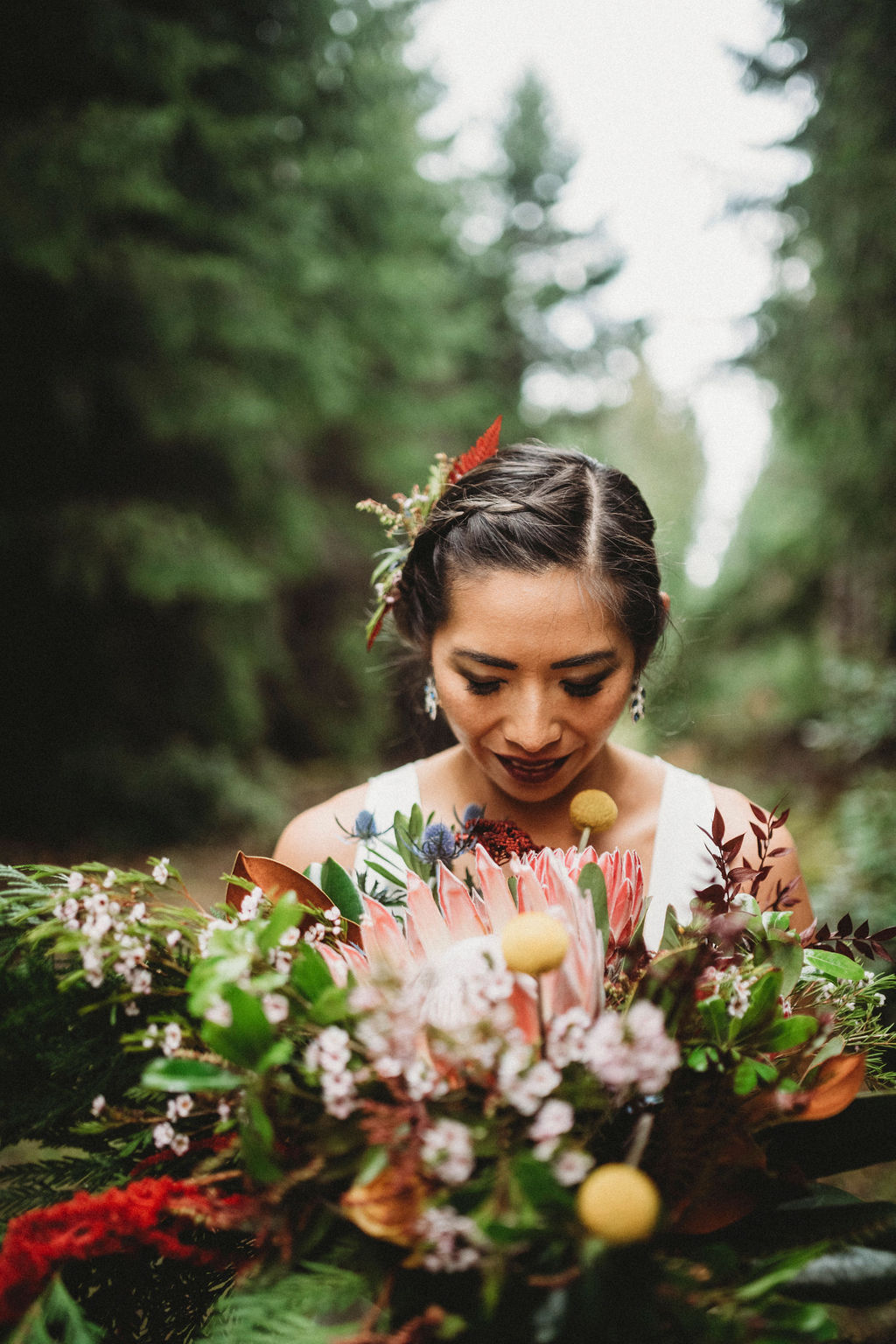 Changing Plans Anastasia Photography closeup of bride looking at her bouquet