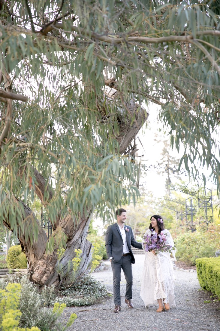 Purple Lilac Spring Wedding Hattie Root Photo couple walking in garden