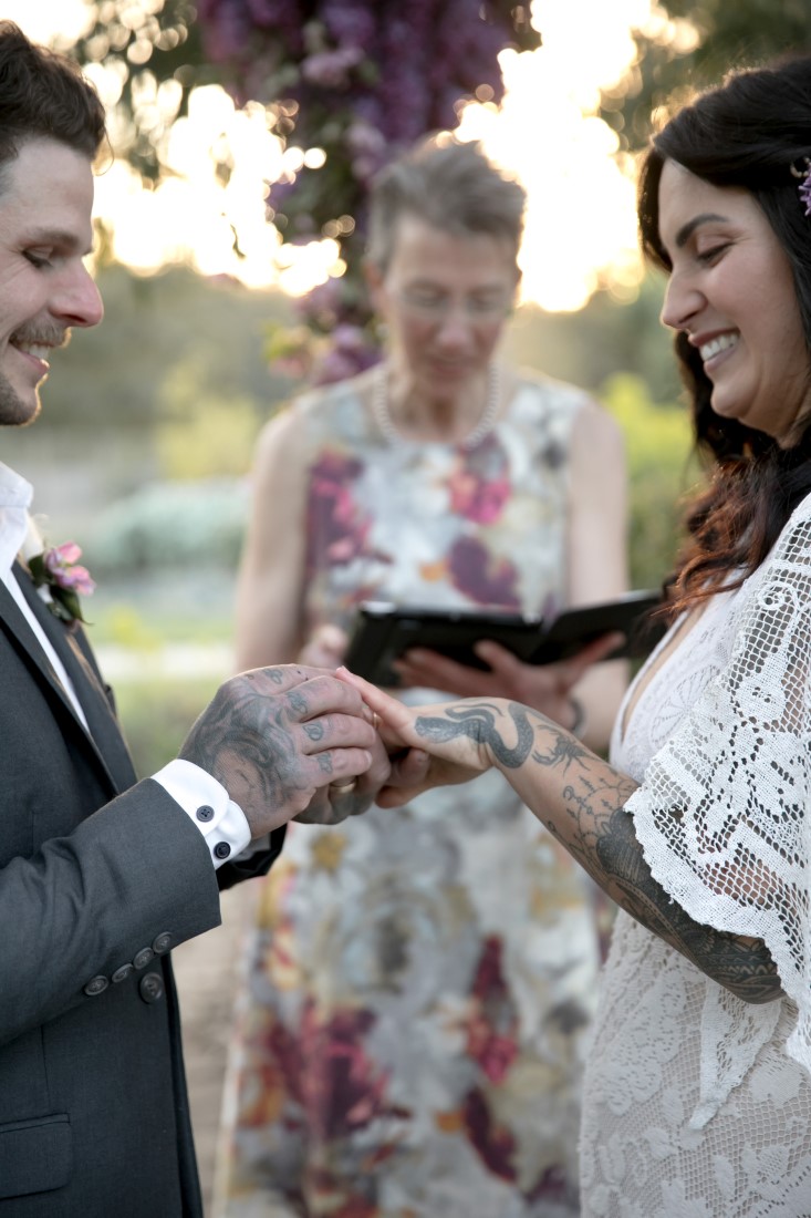 Purple Lilac Spring Wedding Hattie Root Photo Exchanging rings