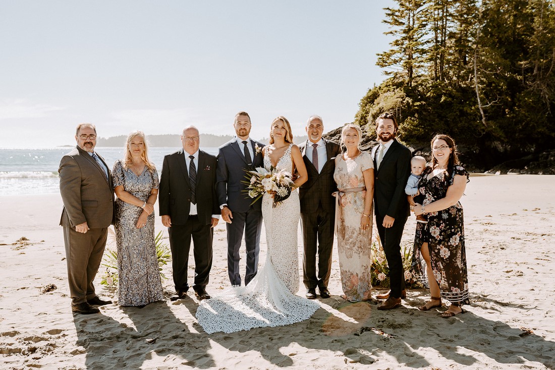 Guests at elopement on Tofino beach by Wild and Wed Photography